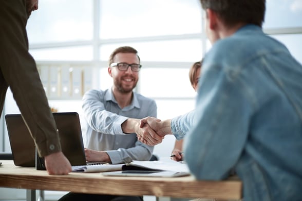 Men shaking hands in office-2-1