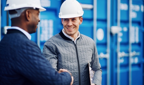two men shaking hands on jobsite