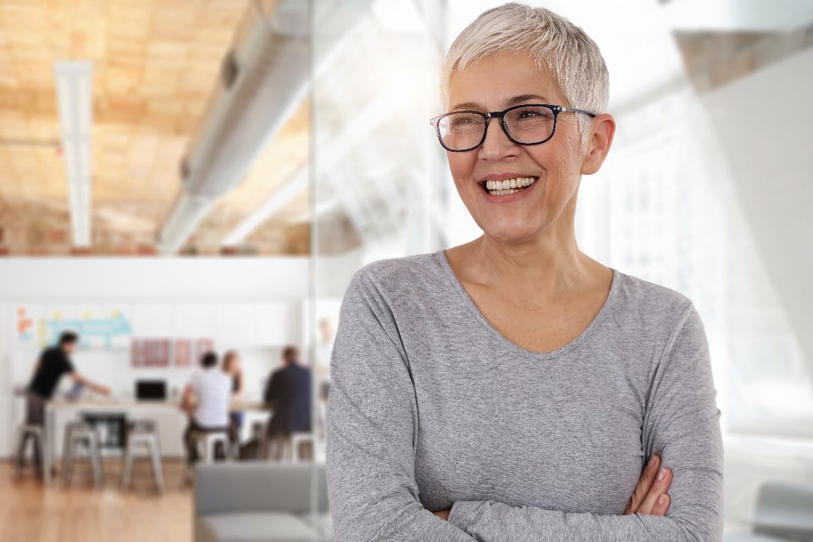 Smiling businesswoman in an office-1.