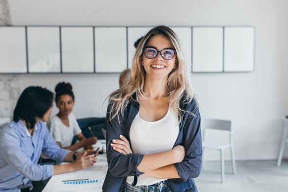 Woman in office smiling at camera-1