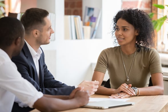 Work employees sitting together at desk in meeting-1